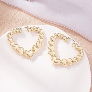 Retro hollow gold plated heart earrings.
